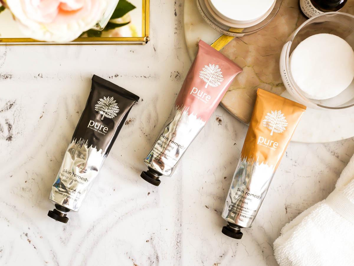 3 Amazing Face Masks from Pure's New Skin Remedy Range | feat Pure Deep Cleansing Mask, Pure Nourishing Face Mask & Pure Brightening Face Mask against tiled backdrop_