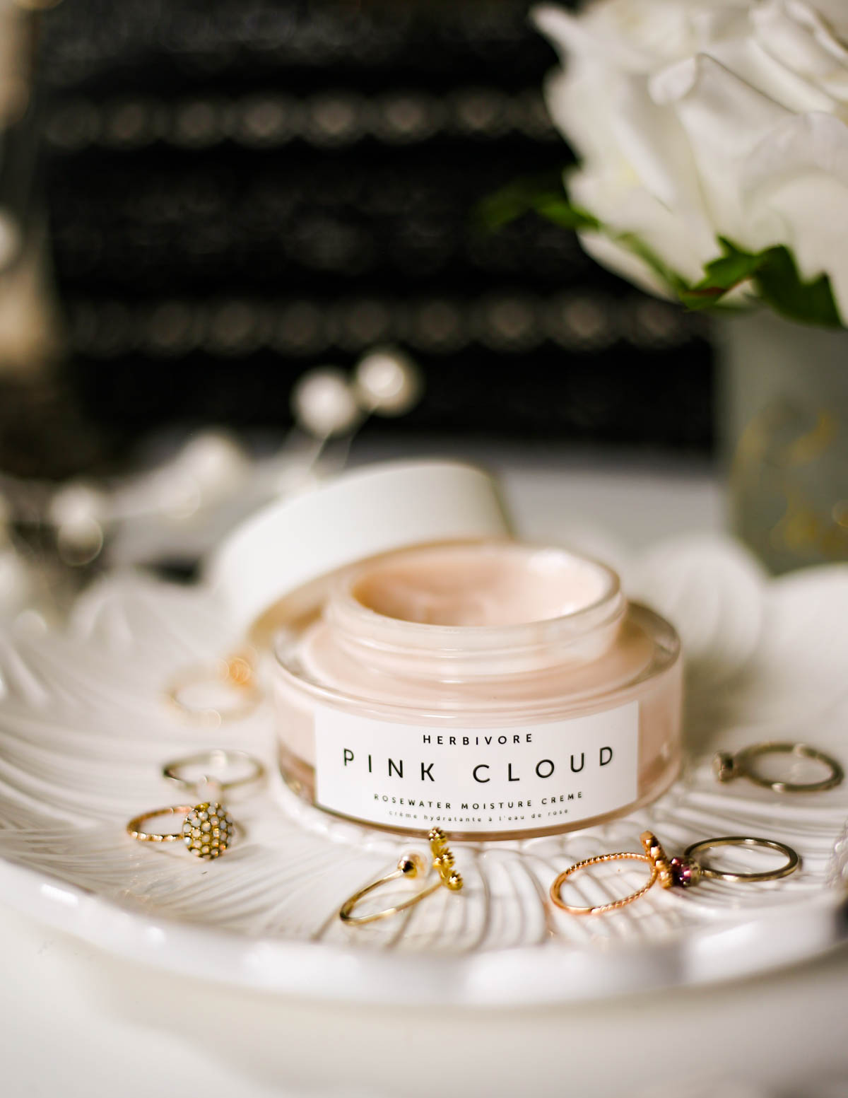 The Basic Skincare Steps you Need in your Routine | feat Herbivore Pink Cloud Rosewater mositure Creme on plate with rings