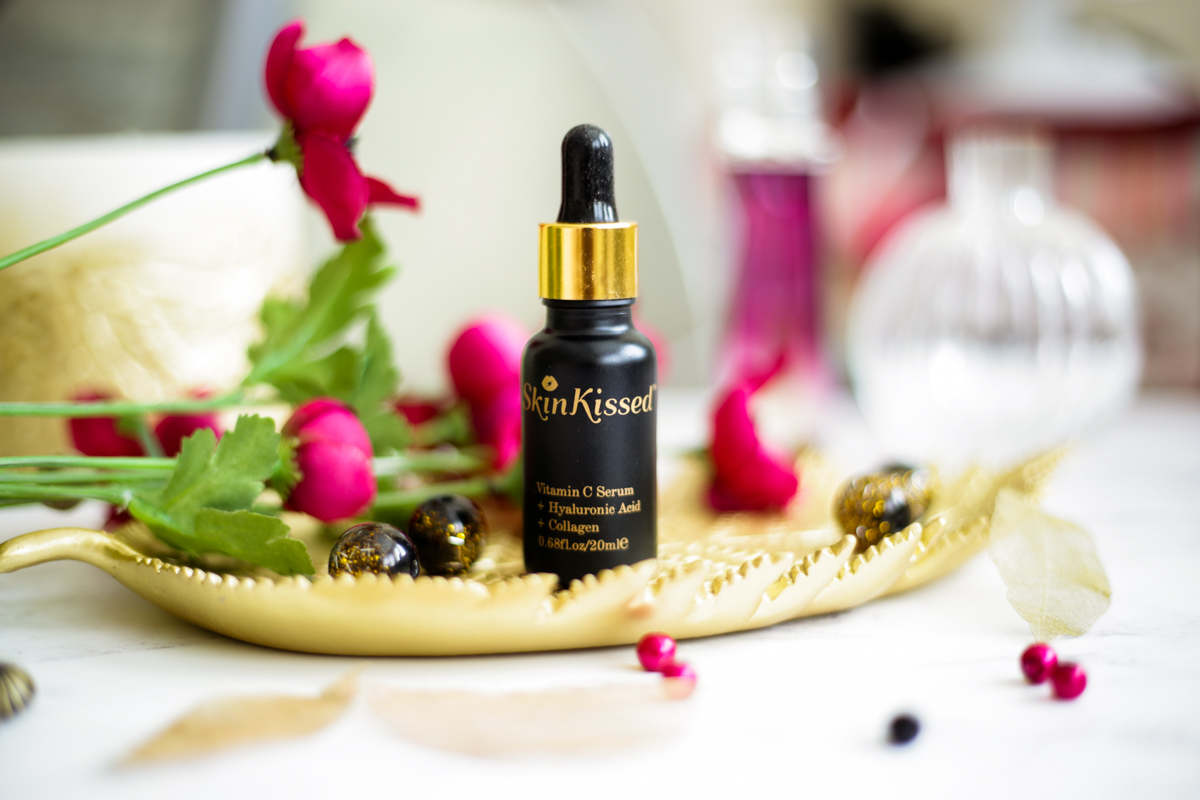 Reviewing the Skinkissed Vitamin C Serum | styled on gold leaf dish